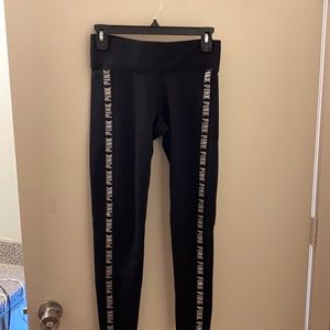 PINK black leggings with “PINK” written down sides